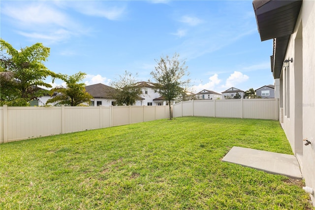 view of yard with a fenced backyard