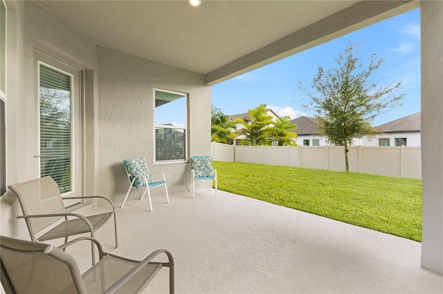 view of patio featuring fence