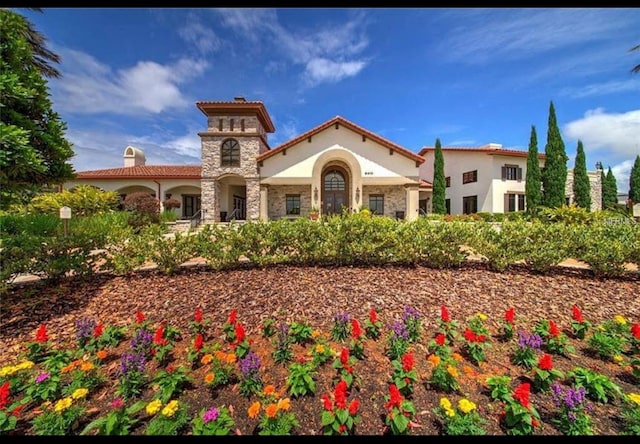 9947 Summerlake Groves St, Winter Garden, FL 34787 - view of front of home with stucco siding and a chimney