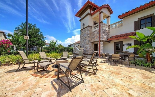 9947 Summerlake Groves St, Winter Garden, FL 34787 - patio / terrace with an outdoor fire pit, a patio area, and outdoor dining area