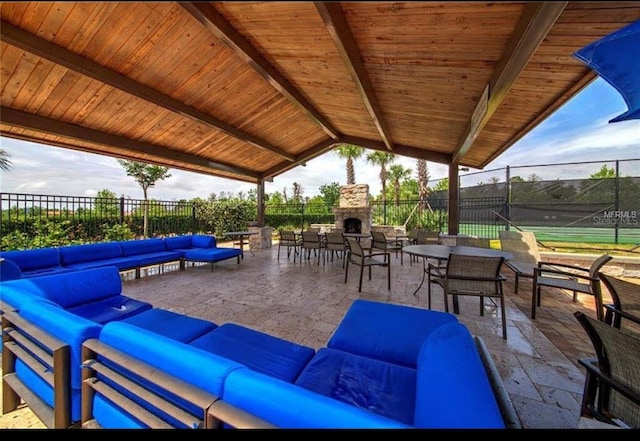 9947 Summerlake Groves St, Winter Garden, FL 34787 - view of patio / terrace featuring an outdoor living space with a fireplace and a tennis court