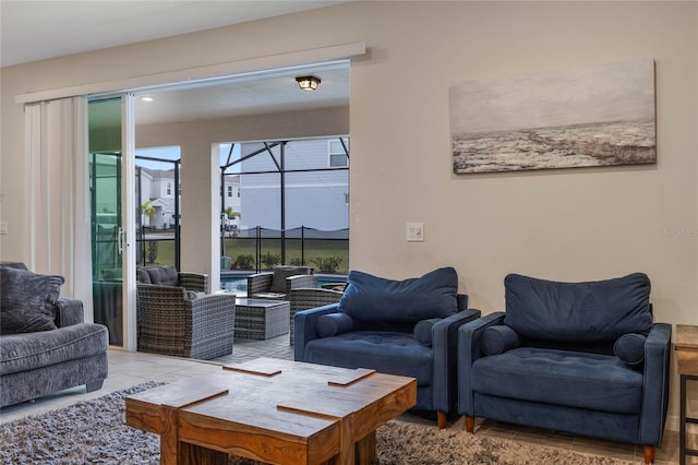 living area featuring a sunroom