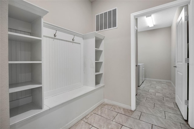 mudroom featuring visible vents and baseboards