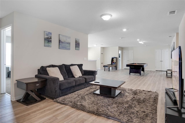 living area with billiards, wood finished floors, visible vents, and baseboards