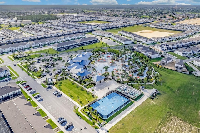 birds eye view of property with a residential view