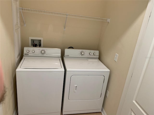 clothes washing area with independent washer and dryer