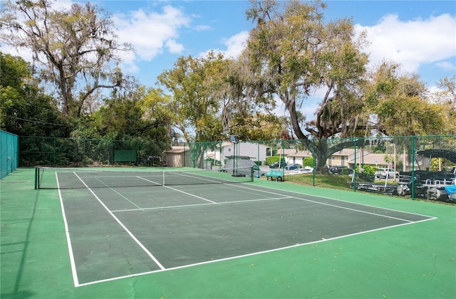 view of sport court with fence