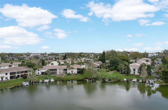 aerial view with a residential view and a water view