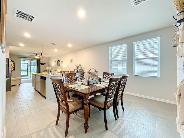 dining room featuring baseboards, visible vents, ceiling fan, and recessed lighting