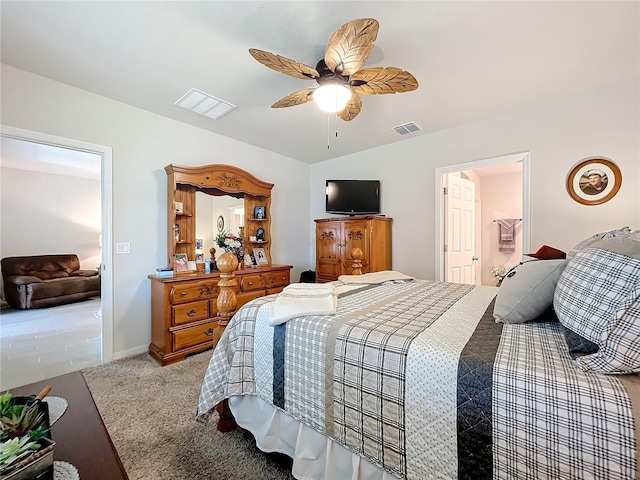 bedroom featuring light carpet, visible vents, a ceiling fan, and lofted ceiling