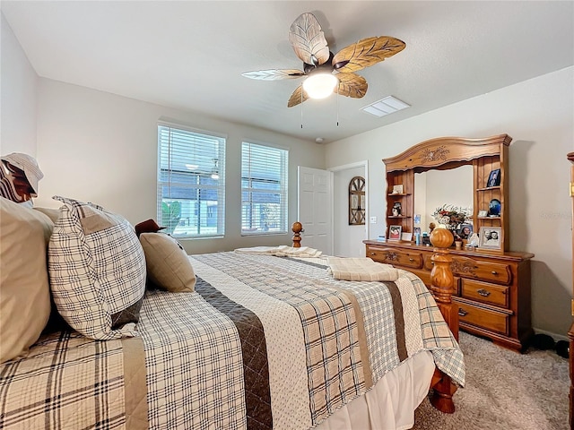 bedroom featuring ceiling fan, visible vents, and light colored carpet