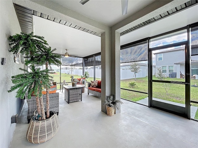 sunroom with a ceiling fan