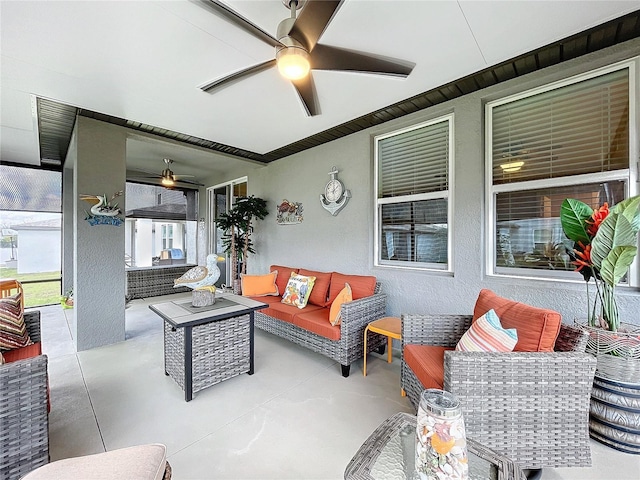 view of patio featuring a ceiling fan and an outdoor living space