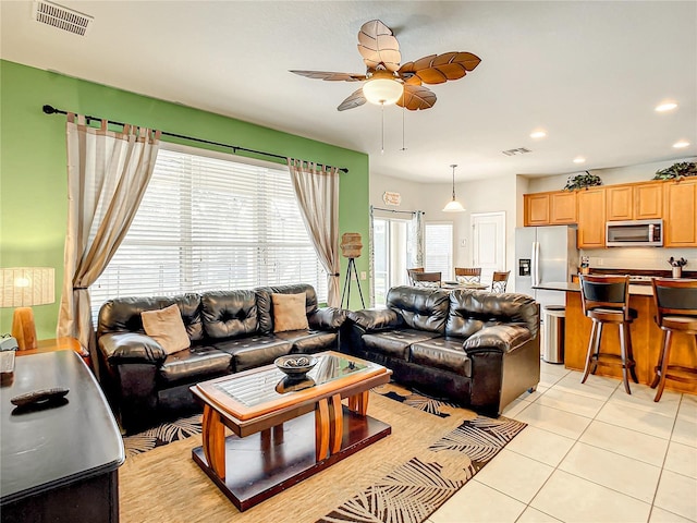 living area featuring recessed lighting, visible vents, ceiling fan, and light tile patterned flooring