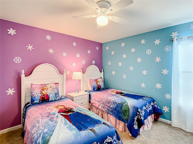 carpeted bedroom featuring a ceiling fan and baseboards