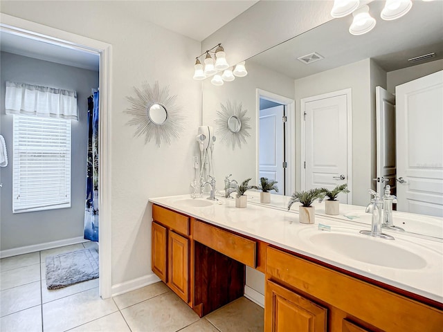 full bathroom with double vanity, tile patterned flooring, a sink, and visible vents