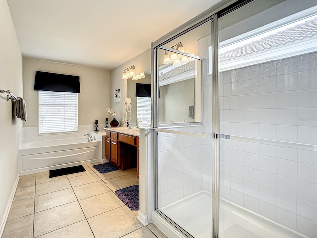 full bathroom featuring a shower stall, vanity, tile patterned flooring, baseboards, and a bath