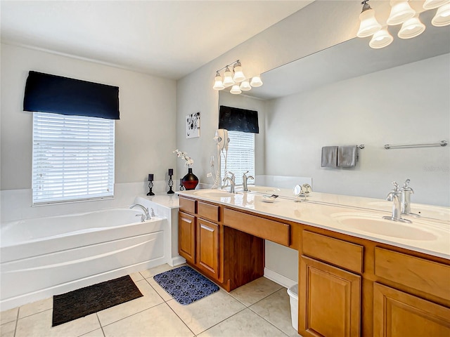 bathroom featuring a garden tub, a sink, and tile patterned floors