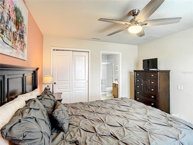 bedroom featuring a closet, connected bathroom, visible vents, and a ceiling fan