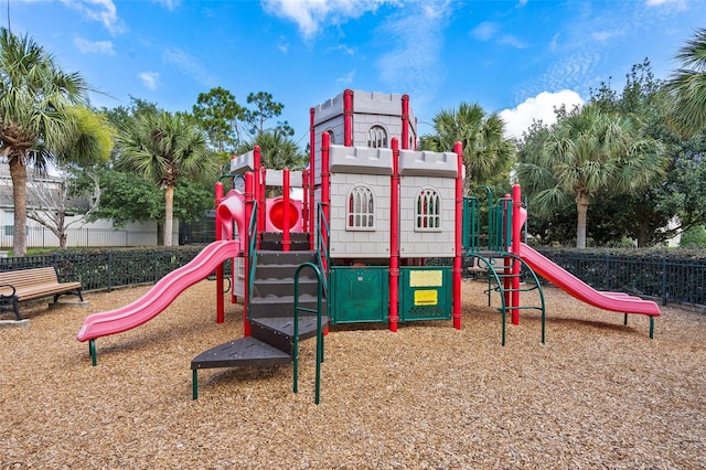 community jungle gym featuring fence