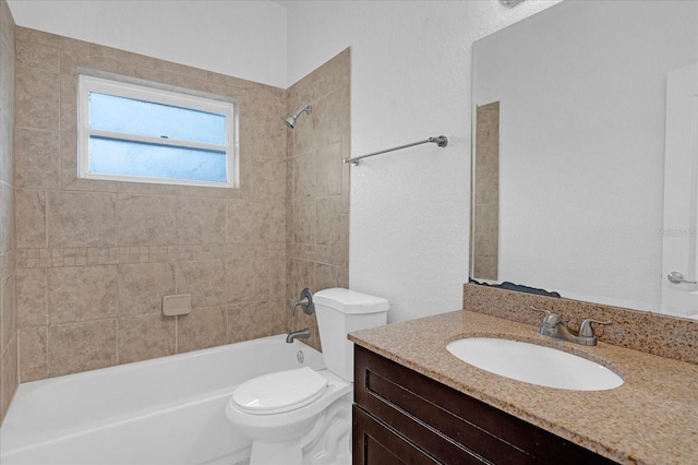 bathroom featuring bathing tub / shower combination, vanity, and toilet