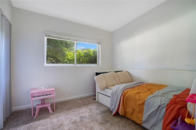 carpeted bedroom with baseboards