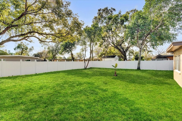 view of yard featuring a fenced backyard