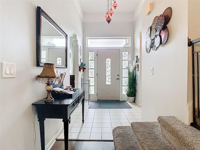 foyer entrance featuring tile patterned flooring and plenty of natural light