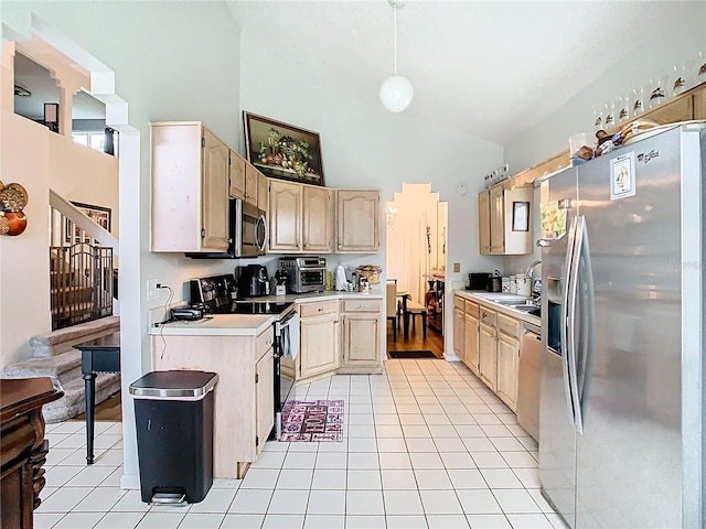 kitchen featuring a sink, light countertops, high vaulted ceiling, and stainless steel appliances