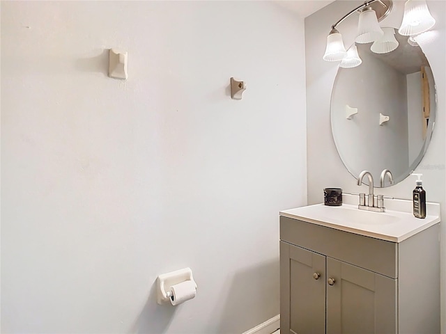 bathroom with vanity and baseboards