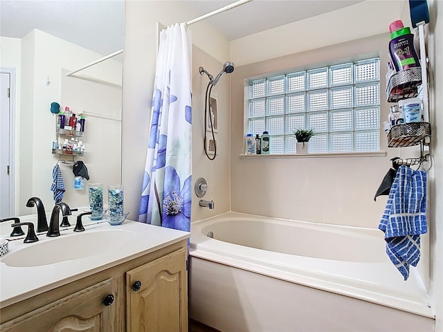 bathroom featuring shower / tub combo with curtain and vanity