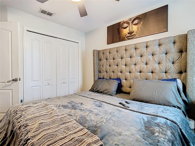 bedroom featuring visible vents, a closet, and ceiling fan