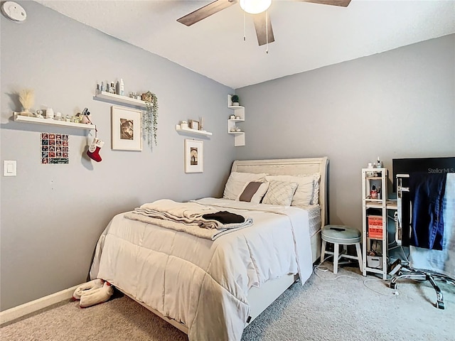 bedroom with baseboards, a ceiling fan, and carpet floors