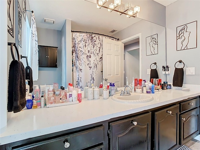 bathroom with visible vents and vanity