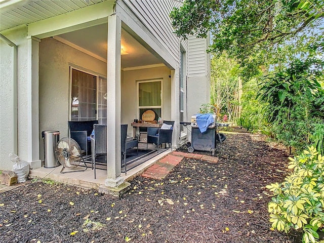 view of patio featuring a grill