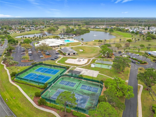 birds eye view of property featuring view of golf course and a water view