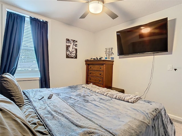 bedroom with baseboards, ceiling fan, and carpet floors