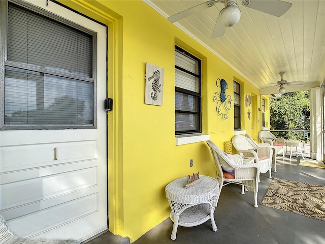 exterior space with a porch and ceiling fan