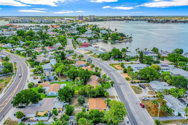 birds eye view of property featuring a residential view and a water view