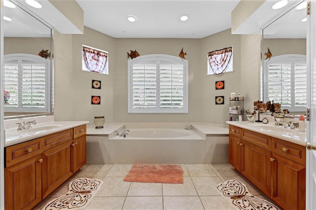 bathroom with a sink, two vanities, and tile patterned floors