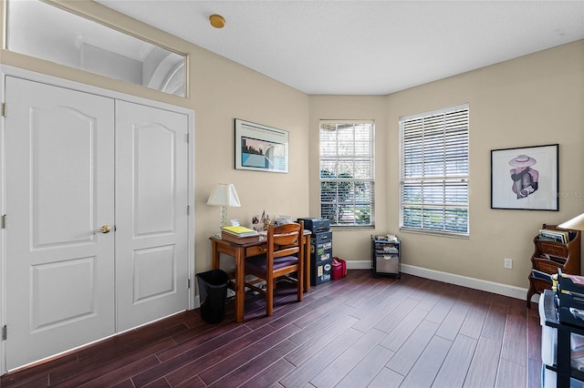 office featuring dark wood-type flooring and baseboards