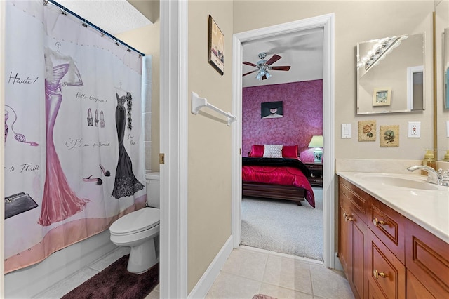 bathroom featuring toilet, a ceiling fan, ensuite bath, tile patterned flooring, and vanity