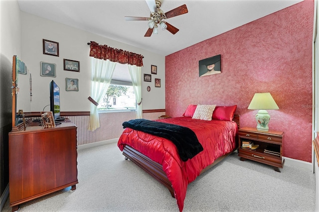 bedroom with baseboards, carpet floors, wainscoting, and wallpapered walls