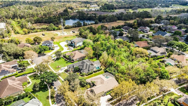 drone / aerial view with a residential view and a water view