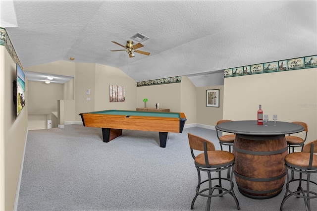 playroom with visible vents, lofted ceiling, a textured ceiling, and carpet flooring