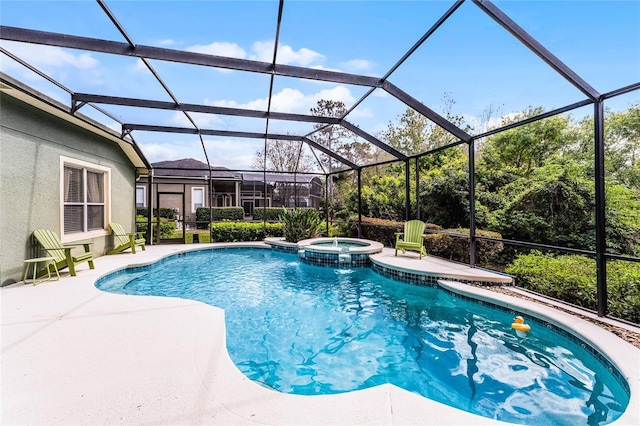 view of swimming pool featuring a patio area, glass enclosure, and a pool with connected hot tub