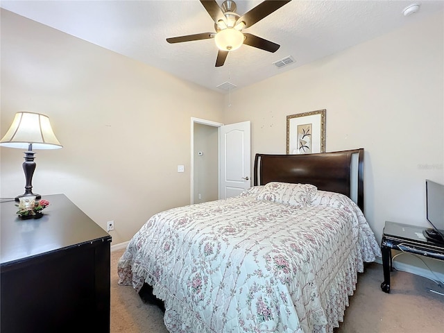 bedroom featuring visible vents, light carpet, ceiling fan, a textured ceiling, and baseboards