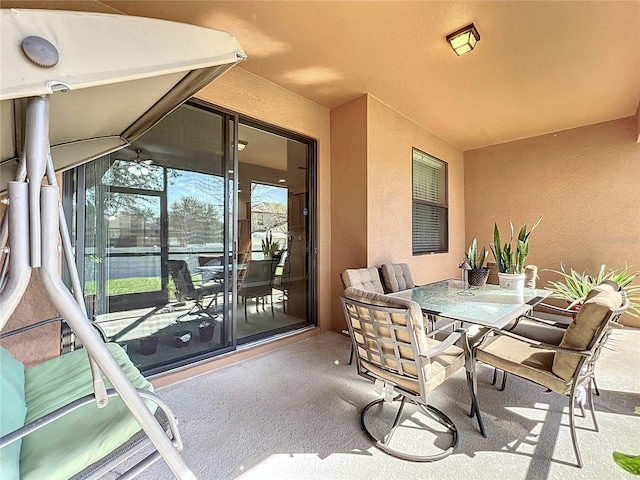 view of patio featuring outdoor dining area