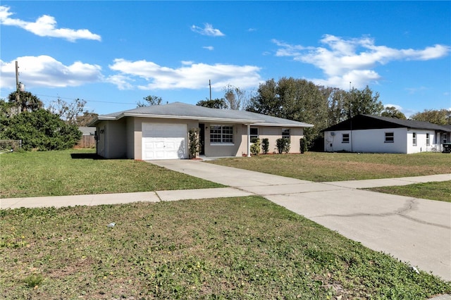 ranch-style house with driveway, an attached garage, and a front yard