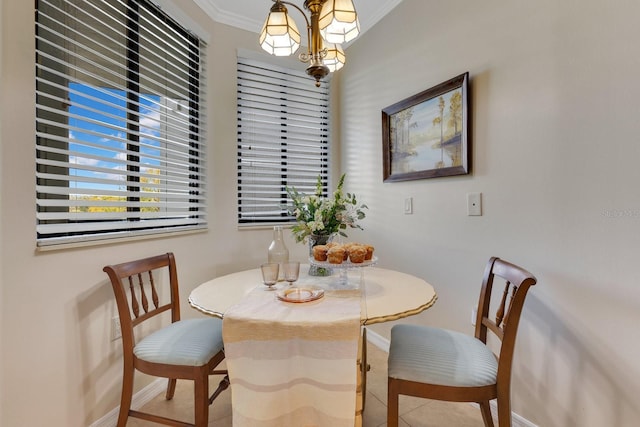 dining space with crown molding and baseboards